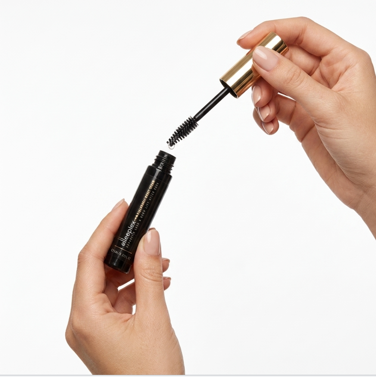 Applying Elleeplex Hyaluronic Boost Serum spoolie brush onto natural lashes and brows for deep daily hydration.