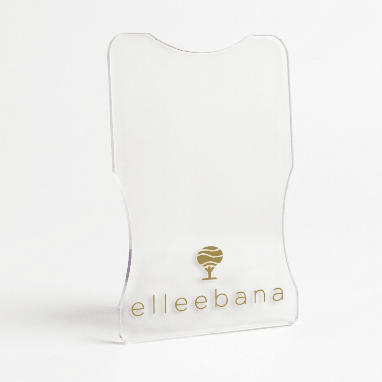 Close-up view of the smooth, curved edge of an Elleebana acrylic under-eye protective guard.
